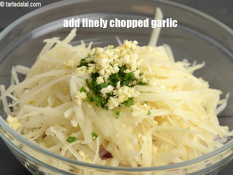 Step 6 – Add 2 tsp finely <a href="https://www.tarladalal.com/glossary-chopped-garlic-790i">chopped garlic (lehsun)</a>.