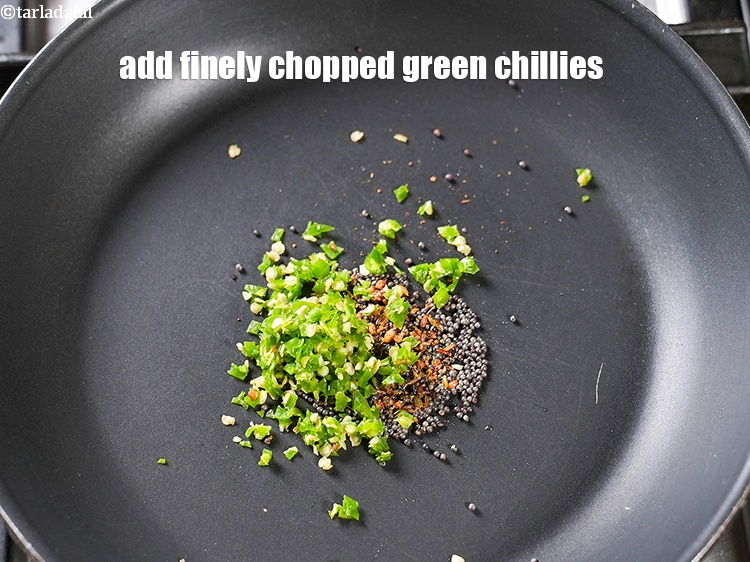 Step 6 – Add 2 tsp finely <a href="https://www.tarladalal.com/glossary-chopped-green-chilli-820i">chopped green chillies</a>.&nbsp;