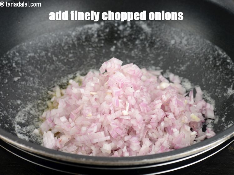 Step 6 – Add 1 cup finely <a href="https://www.tarladalal.com/glossary-chopped-onions-722i">chopped onions</a>.
