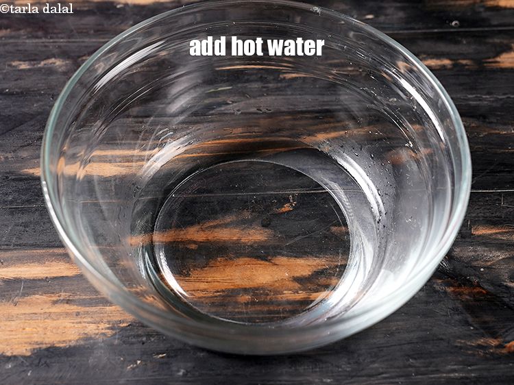 Step 6 – In a deep bowl, add 1/3 cup hot water.&nbsp;