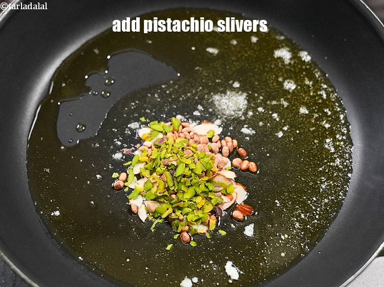 Step 6 – Add &frac12; tbsp <a href="https://www.tarladalal.com/glossary-pistachio-slivers-894i">pistachio slivers</a>.