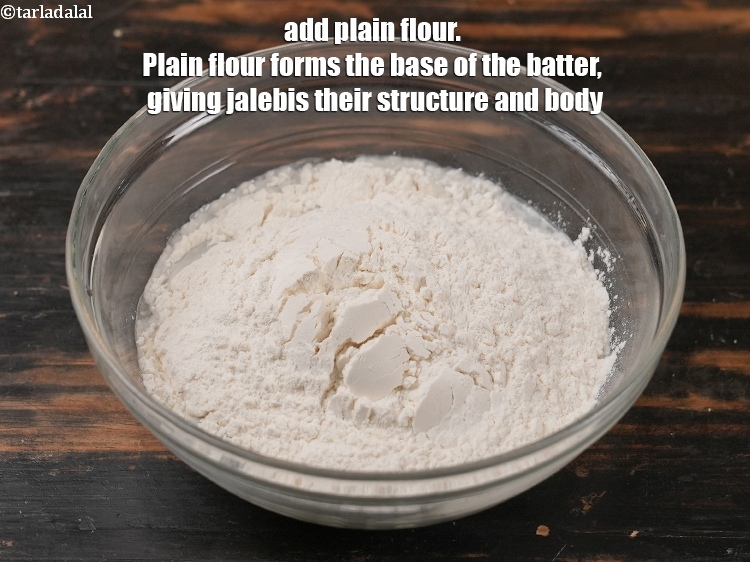 Step 6 – Add 1&frac12; cups of <a href="https://tarladalal.com/glossary-plain-flour-maida-188i">plain flour (maida)</a>.&nbsp;Plain flour forms the base of the batter, …