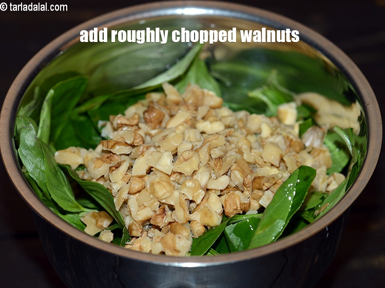 Step 6 – Add 3 tbsp roughly&nbsp;<a href="https://www.tarladalal.com/glossary-chopped-walnuts-785i">chopped walnuts (akhrot)</a>.