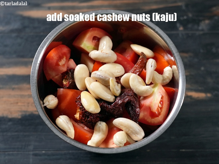 Step 6 – Add 1 tbsp soaked <a href="https://www.tarladalal.com/glossary-cashew-nuts-kaju-840i">cashew nuts (kaju)</a>. and blend till smooth paste.
