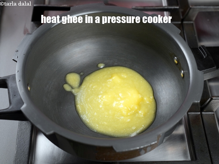 Step 6 – Heat 4 tbsp ghee in a pressure cooker.