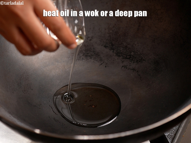 Step 6 – Heat 2 tbsp oil in a wok or a deep pan.&nbsp;