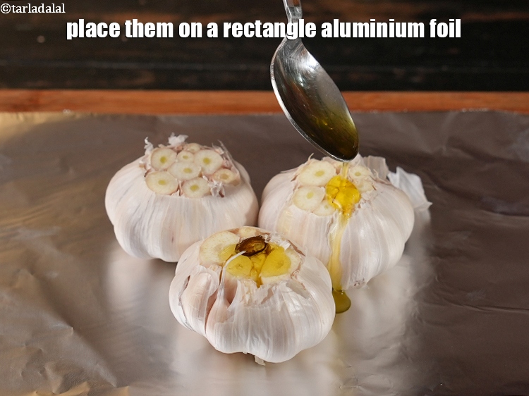 Step 6 – Pour 1 tbsp of <a href="https://www.tarladalal.com/glossary-olive-oil-451i">olive oil</a>. Olive oil carries the distinct taste of garlic, …