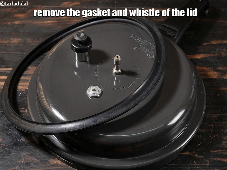Step 6 – Remove the gasket and whistle of the lid.