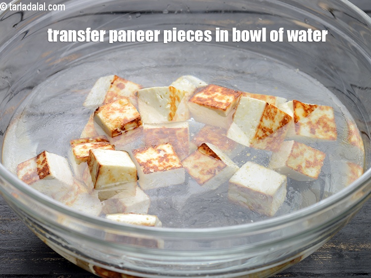 Step 6 – Transfer the paneer pieces in a bowl of water and keep aside.&nbsp;
