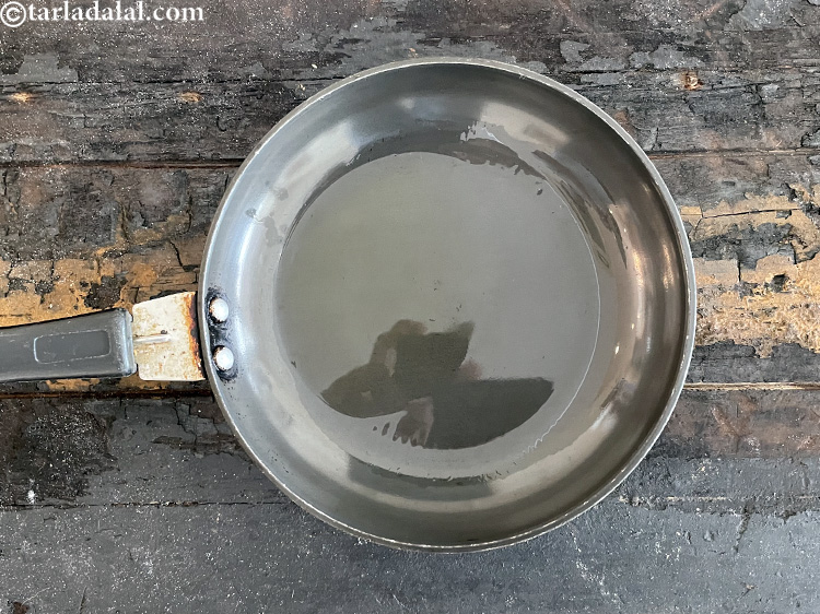 स्टेप 54 – एक छोटे नॉन स्टिक पैन में १ टी-स्पून घी गरम …