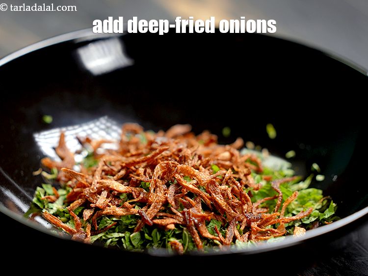 Step 43 – Add 1/4 cup&nbsp;<a href="https://www.tarladalal.com/glossary-fried-onions-924i">deep-fried onions</a>.&nbsp;