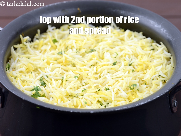 Step 47 – Top it with the 2nd portion of the rice and spread it evenly.