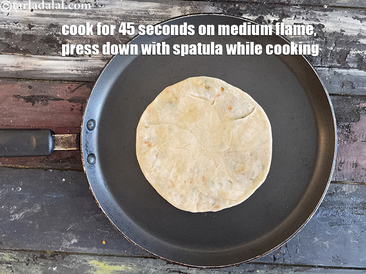 Step 40 – <meta charset="UTF-8" /> Cook lightly on a hot non-stick tava (griddle) for 45 seconds on …