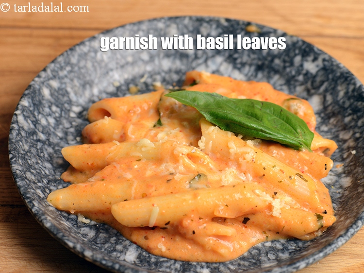 Step 44 – Garnish with <a href="https://www.tarladalal.com/glossary-basil-185i">basil</a> leaves.