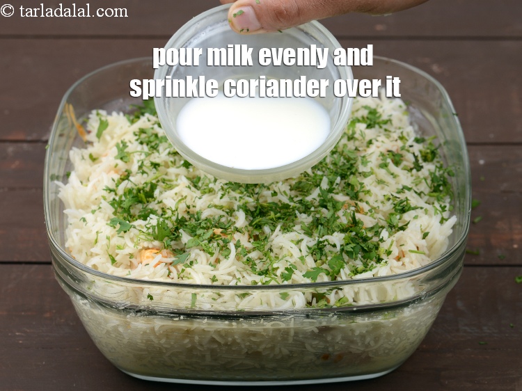 Step 44 – Pour the milk evenly over it and sprinkle coriander all over it.