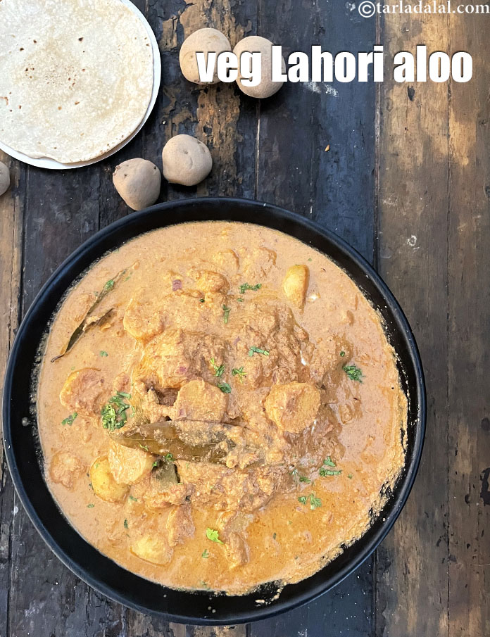 Step 60 – Serve <strong>Lahori aloo | veg Lahori aloo | Lahori aloo curry |&nbsp;</strong>hot with <a href="https://www.tarladalal.com/roti--how-to-make-soft-roti-or-phulka-or-chapati-38565r">roti</a>.