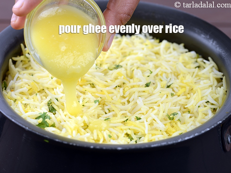 Step 48 – Pour 2 tbsp ghee evenly over the rice.&nbsp;