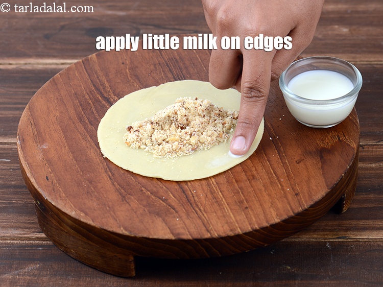 Step 45 – Apply little milk on the edges.