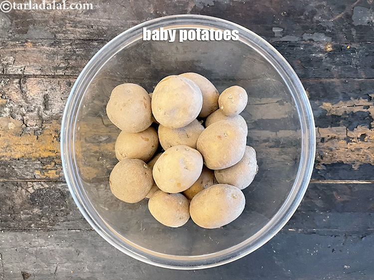 Step 3 – In a glass bowl put the baby potatoes.&nbsp;<strong>Baby potatoes are small potatoes that are harvested …
