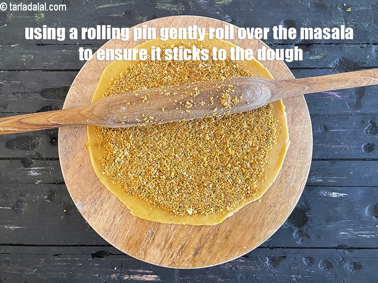Step 43 – Gently roll over the masala evenly using a rolling pin,&nbsp;to ensure that the masala sticks …