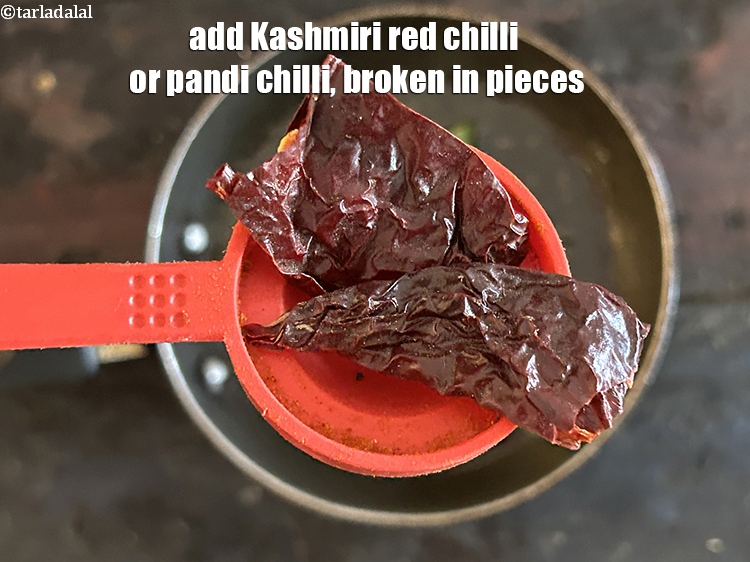 Step 45 – <html><head></head><body><p>Add&nbsp;1&nbsp;<a href="glossary-fresh-red-chillies-lal-mirch-lal-mirchi-334i">red chilli</a>&nbsp;(pandi) , broken into pieces.</p></body></html>