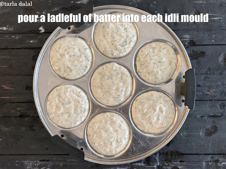 Step 42 – <meta charset="UTF-8" />Pour a ladleful of batter into each greased idli mould.&nbsp;&nbsp;