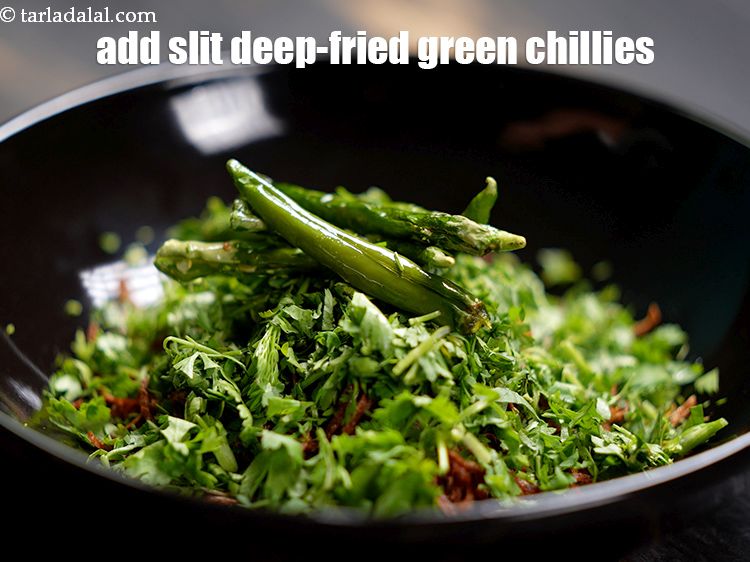 Step 45 – Add 5&nbsp;<a href="https://www.tarladalal.com/glossary-fried-green-chillies-2406i">slit deep-fried green chillies</a>.&nbsp;