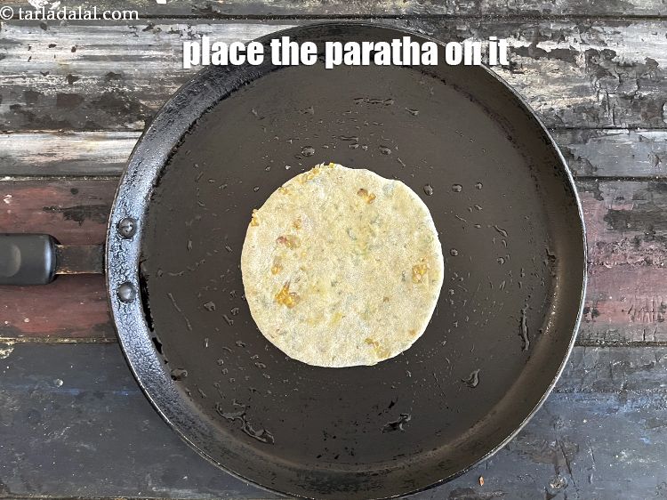 Step 54 – &nbsp; <meta charset="UTF-8" /> Place the paratha on it.&nbsp;