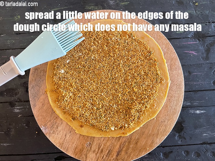 Step 44 – <meta charset="UTF-8" /> Spread a little water at the circumference of the dough circle which …
