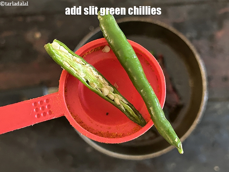 Step 46 – <p>Add <strong>1</strong>&nbsp;<a href="glossary-slit-green-chillies-1856i">slit green chillies</a>.</p>