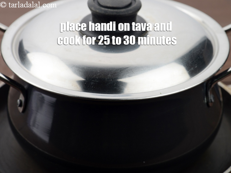 Step 50 – Place the handi on a non-stick tava (griddle) and cook on a slow flame for …
