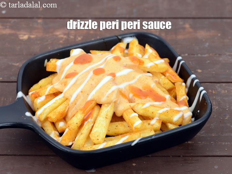 Step 47 – Drizzle 1 tsp&nbsp;readymade&nbsp;<a href="https://www.tarladalal.com/glossary-peri-peri-sauce-2793i">peri peri sauce</a>.