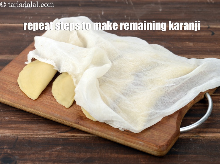 Step 47 – Repeat steps to make remaining more karanjis, cover them with muslin cloth and keep aside.