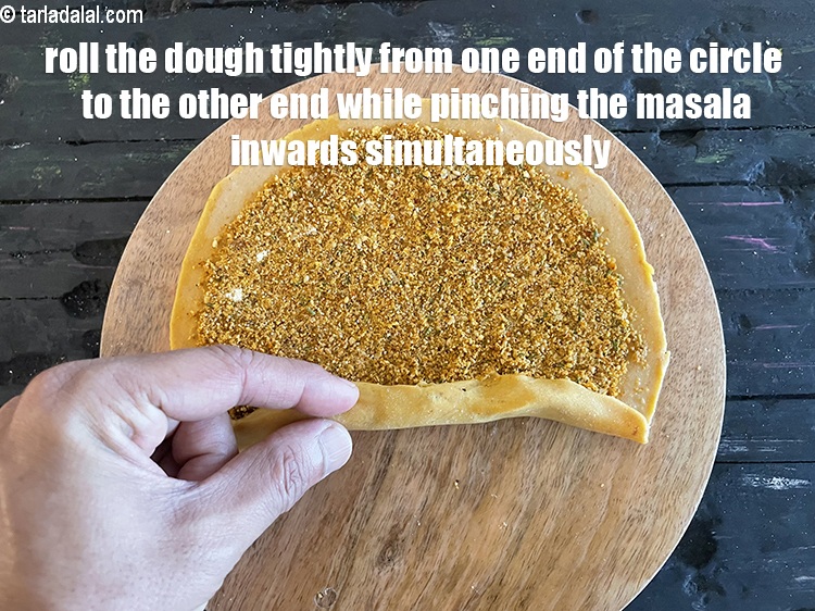 Step 45 – Immediately start rolling very tightly from one end of the circle towards the other end …