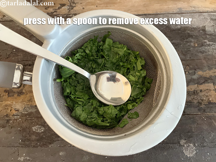 Step 15 – Press with a spoon to remove excess water.