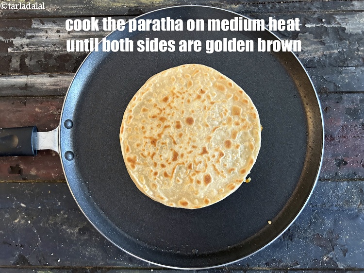Step 46 – Cook the paratha on medium heat until both sides are golden brown.
