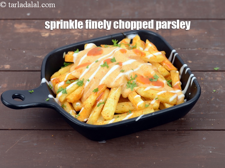 Step 48 – Sprinkle 1 tsp finely <a href="https://www.tarladalal.com/glossary-chopped-parsley-793i">chopped parsley</a>.