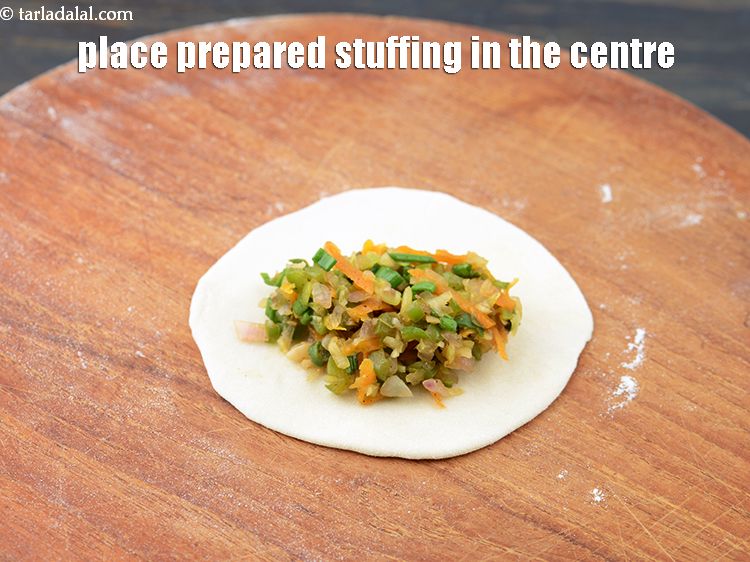 Step 48 – Place 1 tbsp prepared stuffing in the centre of the circle.