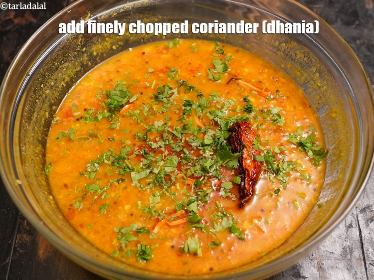 Step 48 – Add&nbsp;2 tbsp&nbsp;finely&nbsp;<a href="https://www.tarladalal.com/glossary-chopped-coriander-783i">chopped coriander (dhania)</a>.