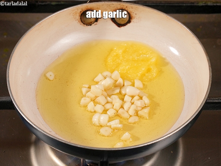 Step 47 – Add&nbsp;1/2 tbsp&nbsp;<a href="https://www.tarladalal.com/glossary-chopped-garlic-790i">chopped garlic (lehsun)</a>.