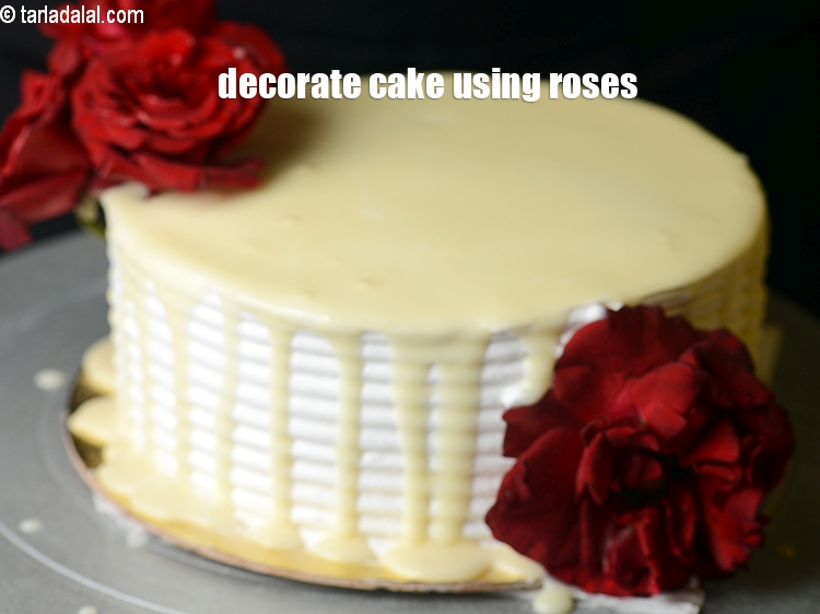 Step 50 – Decorate the cake using fresh and cleaned red roses.