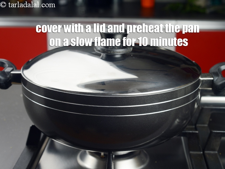 Step 47 – Cover with a lid and preheat the pan on a slow flame for 10 minutes.