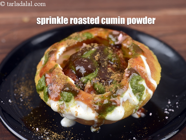 Step 50 – Sprinkle roasted cumin powder.