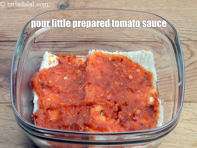 Step 48 – Pour &frac14; cup prepared tomato sauce and spread it evenly.