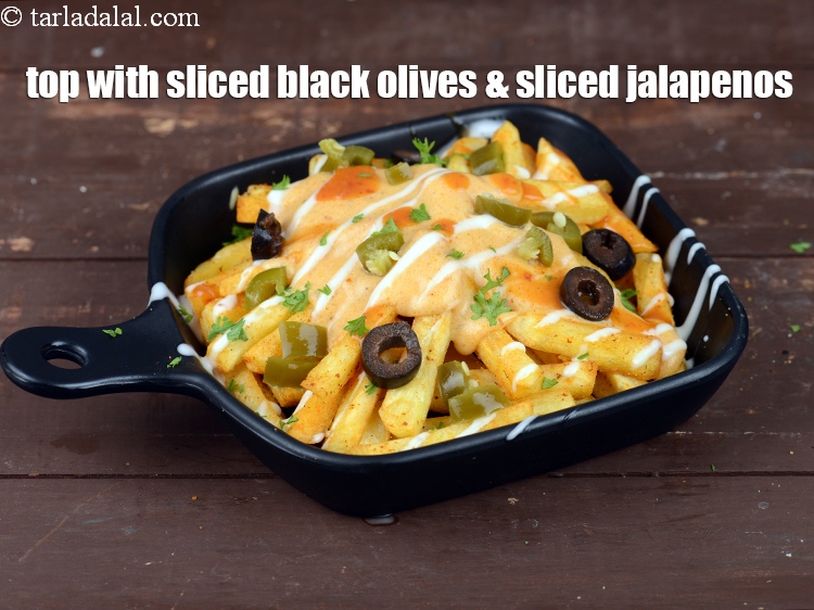 Step 49 – Top with 4 to 5&nbsp;<a href="https://www.tarladalal.com/glossary-sliced-black-olives-1069i">sliced black olives</a>.&nbsp;Also top with 1 tbsp&nbsp;<a href="https://www.tarladalal.com/glossary-chopped-jalapenos-1242i">chopped jalapenos</a>.