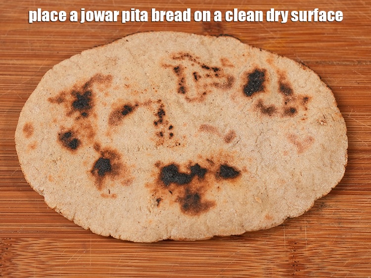 Step 49 – Place a jowar pita bread on a clean dry surface.