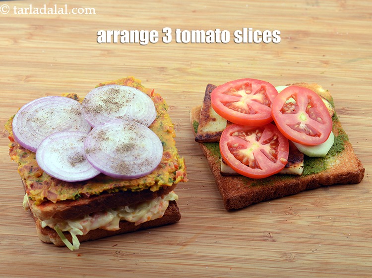 Step 49 – Arrange 3 <a href="https://www.tarladalal.com/glossary-tomato-slices-1823i">tomato slices</a> evenly over it.