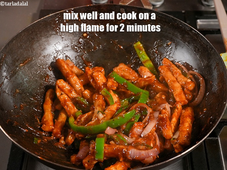 Step 48 – Mix well and cook on a high flame for 2 minutes.