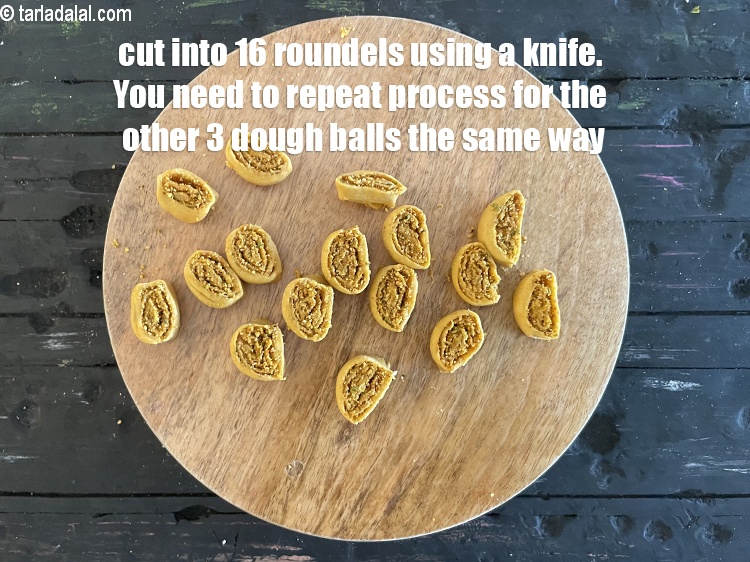 Step 49 – Now cut it into 16 to 18 equal roundels using a knife and separate out …
