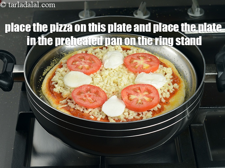 Step 49 – Place the assembled Margherita pizza on this plate and place the plate in the preheated …